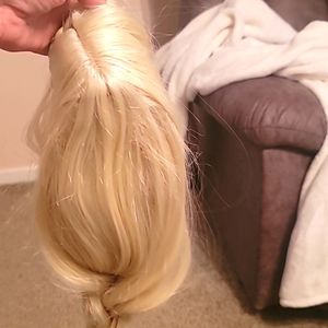 Long blonde hair wig.